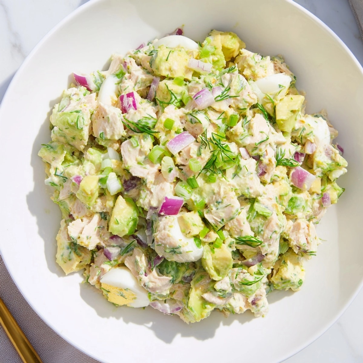 Hearty, flavorful Avocado Ranch Tuna Egg Salad with avocado chunks and a vibrant dressing.