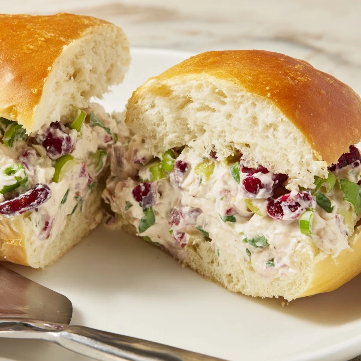 Spicy cranberry dip spread on pillowy rolls, perfect for holiday gatherings and celebrations.