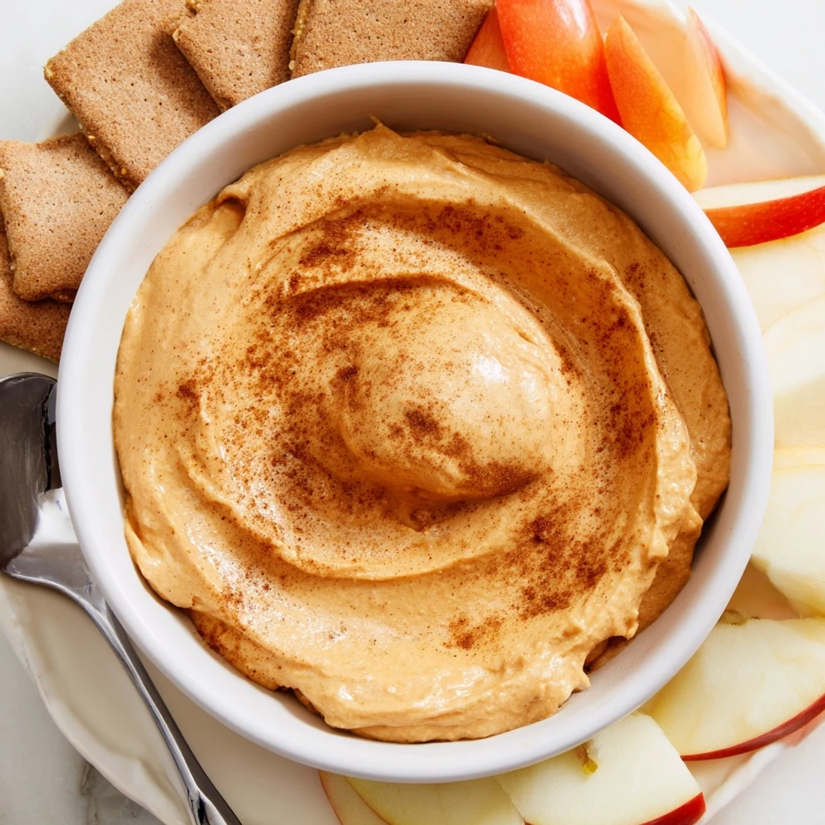 Creamy Thanksgiving Pumpkin Pie Dip served with cookies for a festive treat.  
