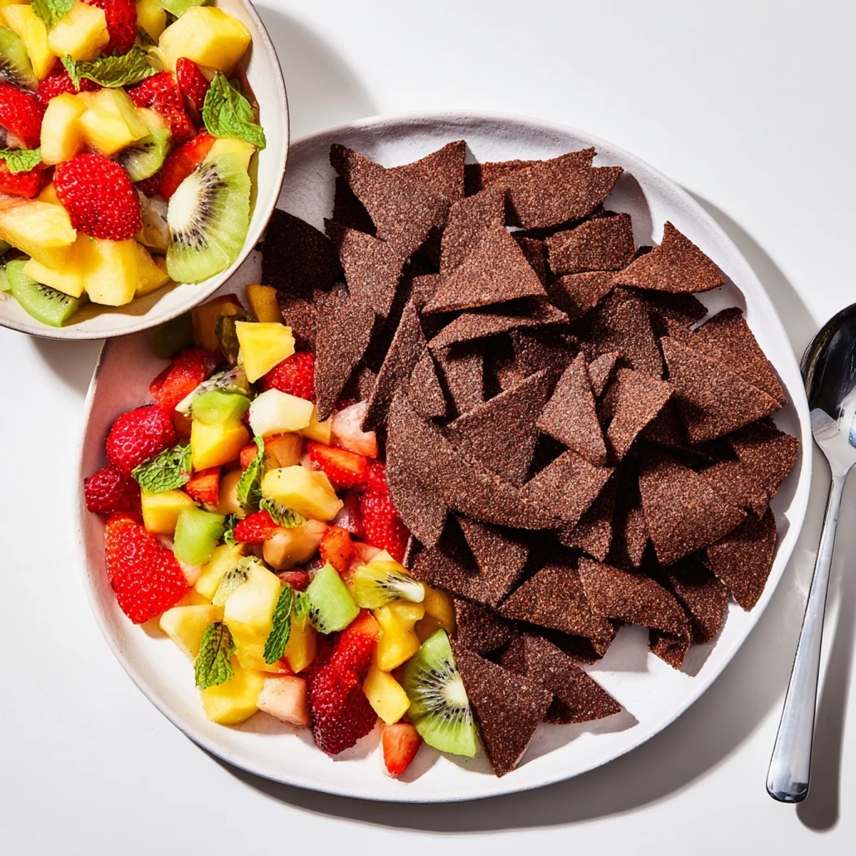 Crispy chocolate tortilla chips with vibrant fruit salsa for a fun dessert.  