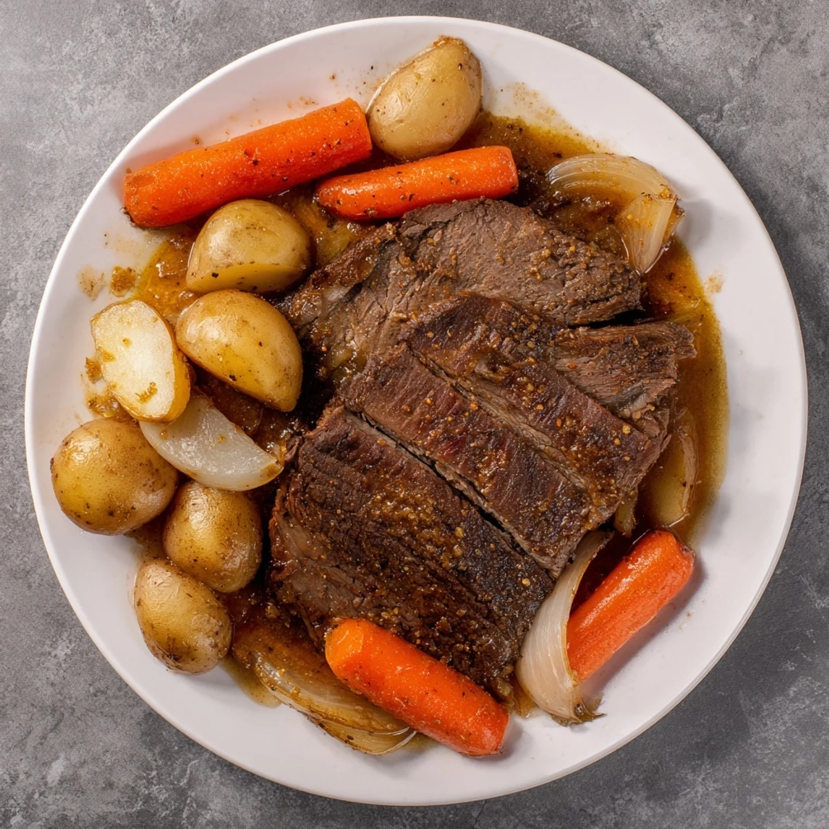 Tender Pickle Brine Pot Roast resting in a Dutch oven with carrots, ready to serve with savory juices.