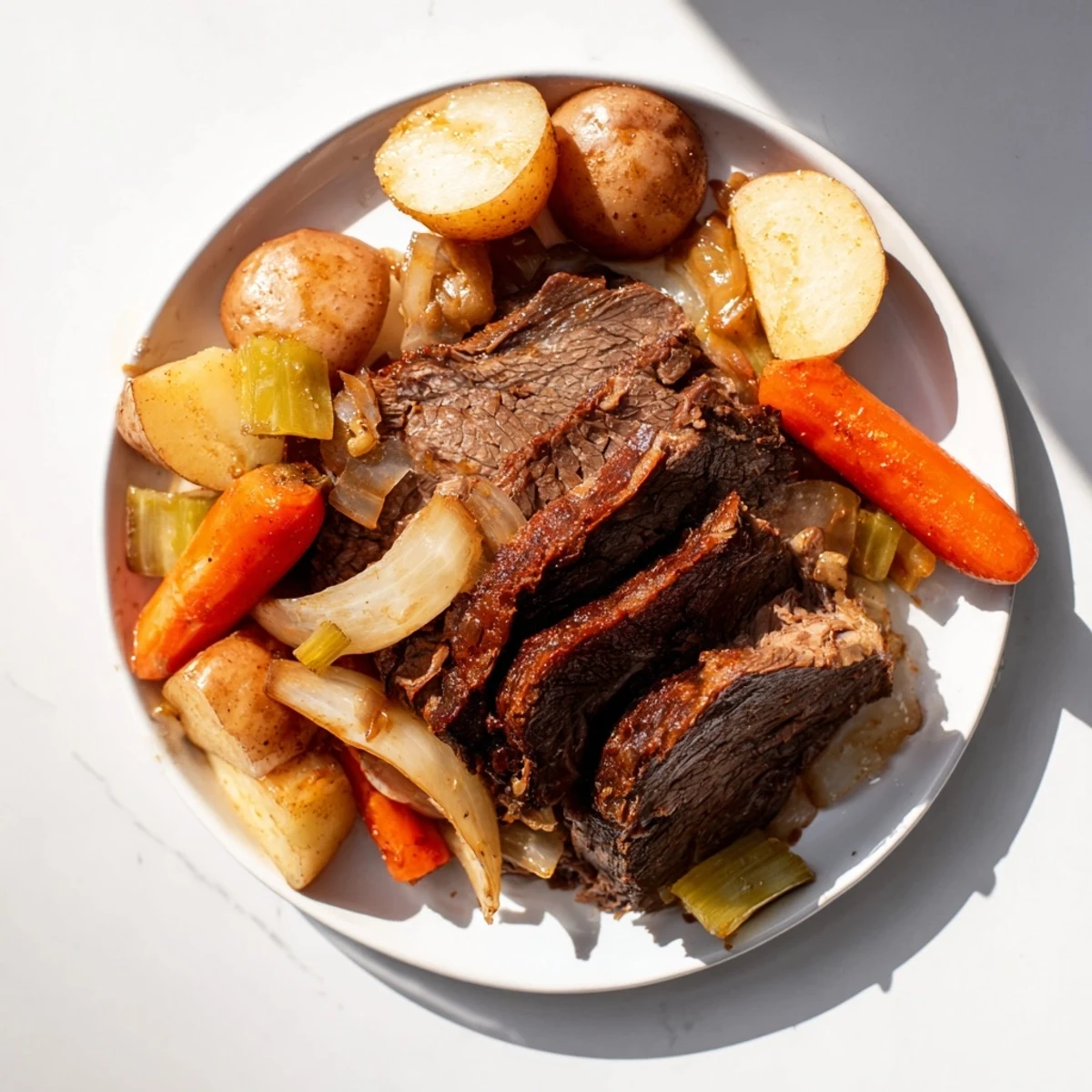 Savory Pickle Brine Pot Roast with a rich, dark sauce, perfect alongside crusty bread and tender vegetables.