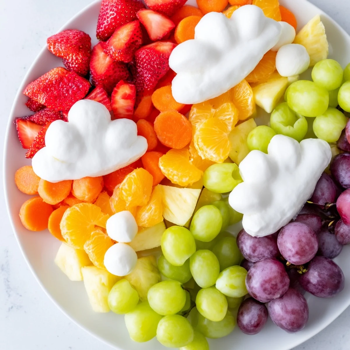 Rainbow Cloud Snack Board bursting with colorful fruits, perfect for a fun and healthy snack spread.
