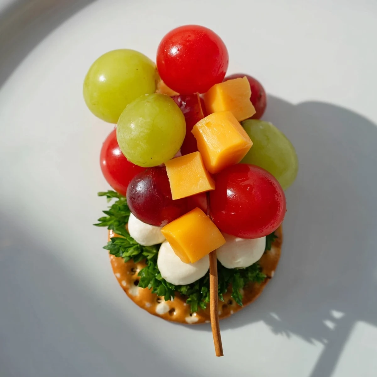Up, Up, & Away Hot Air Balloon Snacks offer colorful cherry tomatoes and grapes atop crackers.