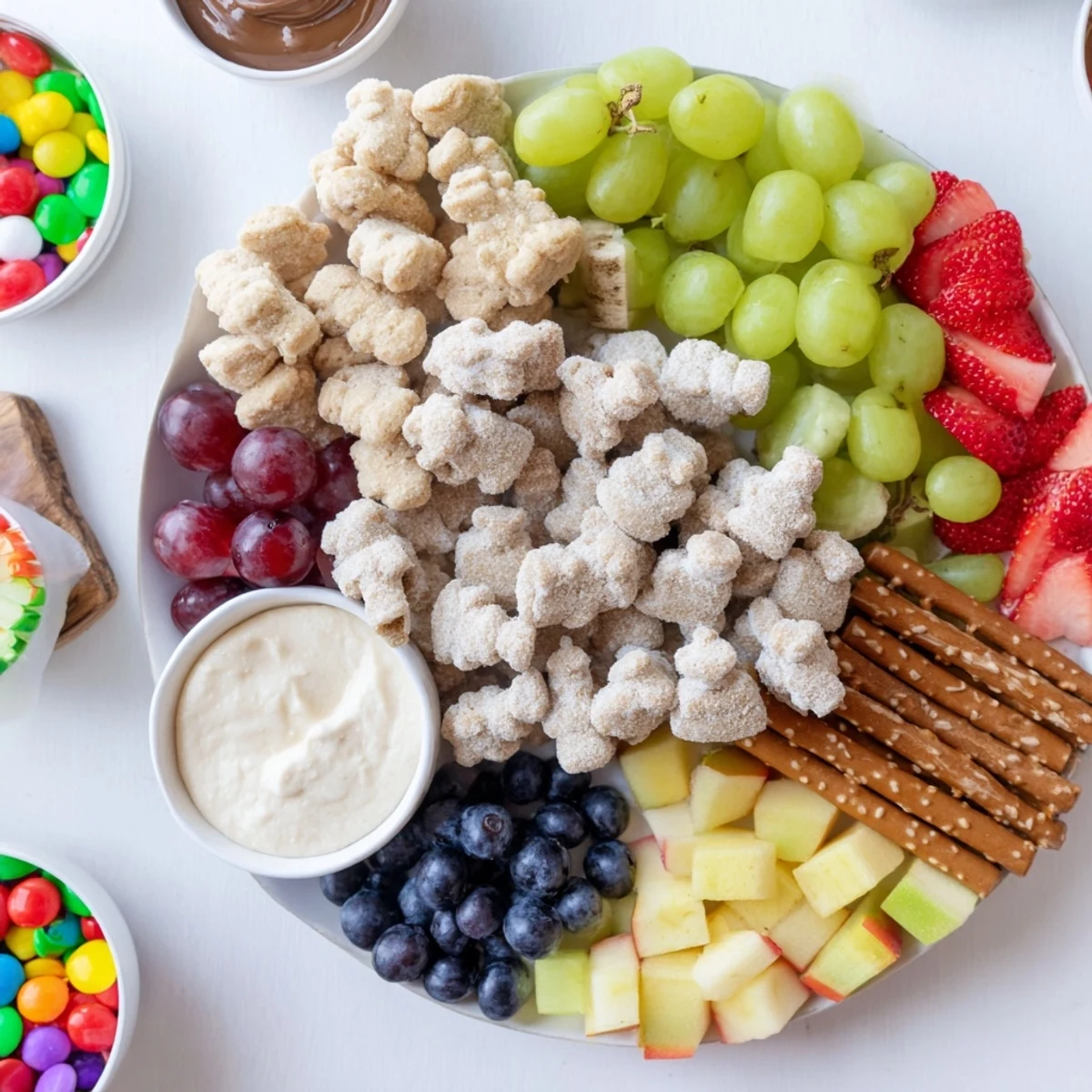 Colorful Animal Cracker Safari Board featuring fresh fruit, dips, and joyful, sweet treats.