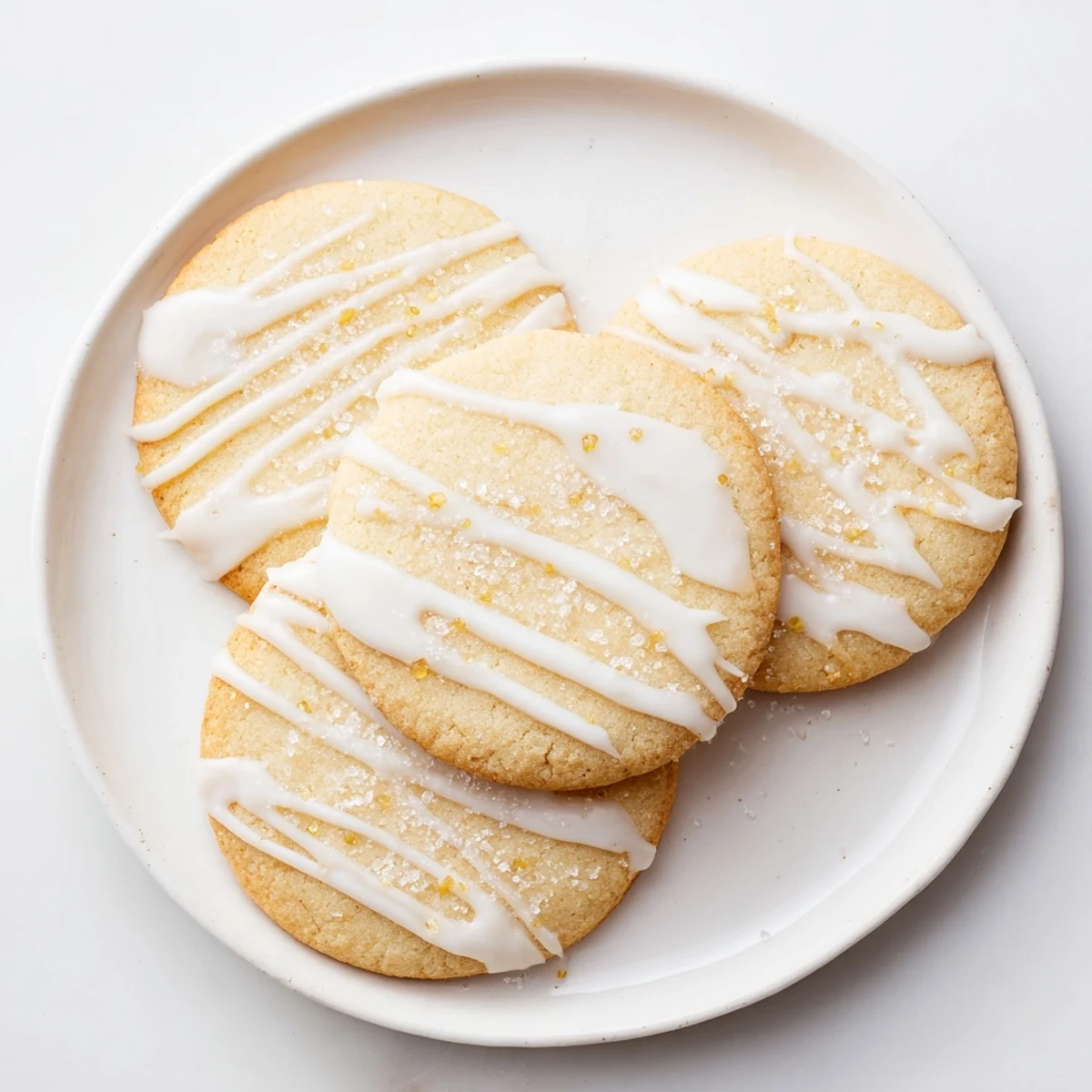 The perfect batch of holiday cookies with icing drizzle, ready to brighten any dessert table and taste.