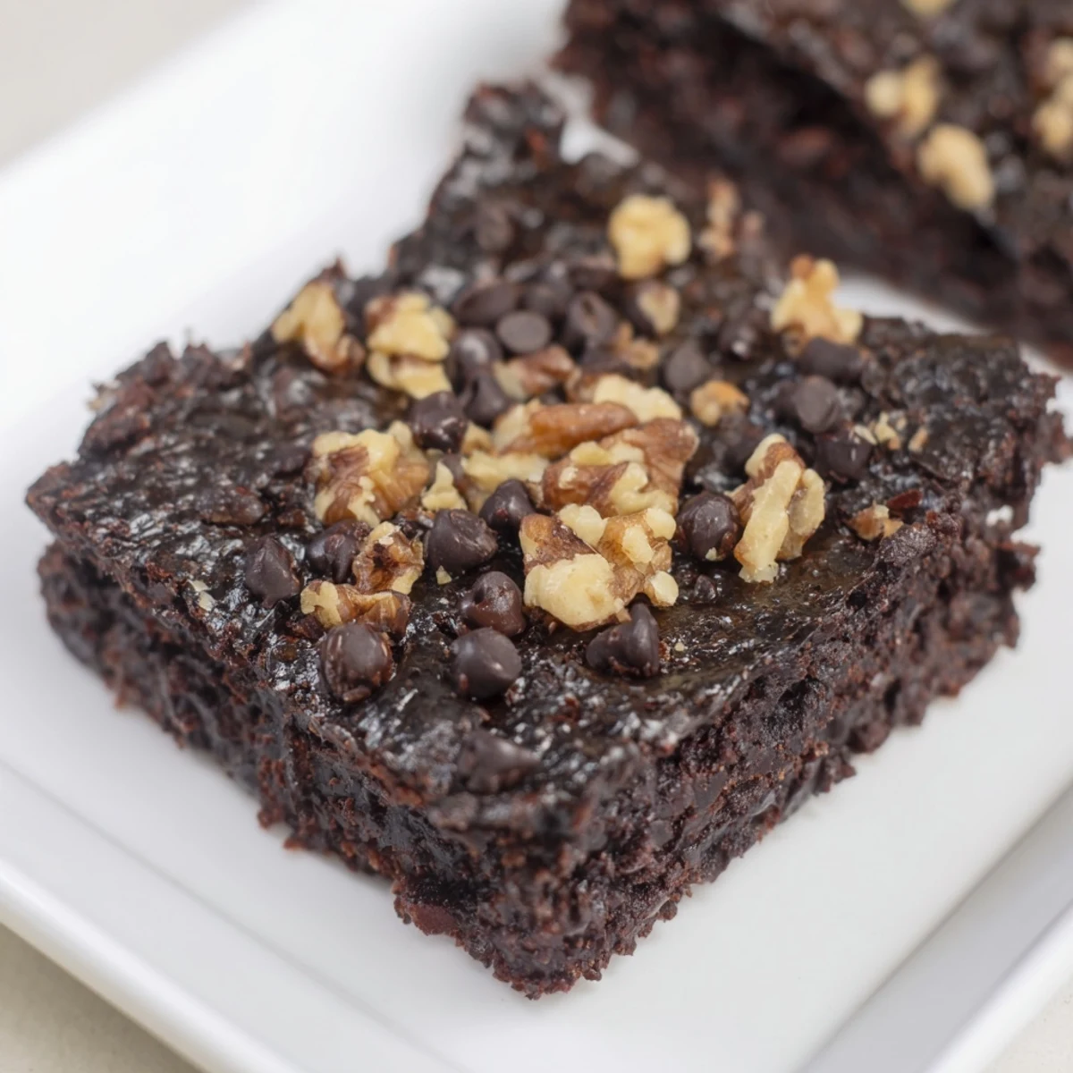 Fudgy, flourless black bean brownies, perfect for dessert with a scoop of vanilla ice cream.