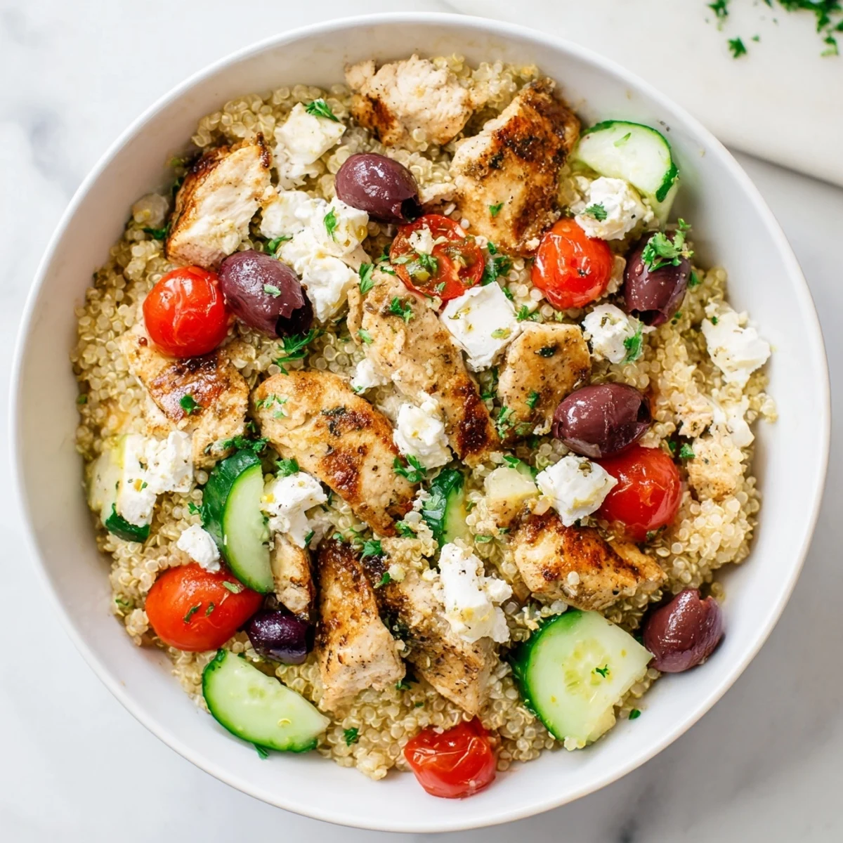 Bright Mediterranean Chicken Bowl with juicy chicken, creamy feta, and crisp cucumbers, ready for a quick and healthy dinner.