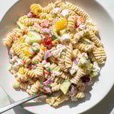 Cool, cooked pasta coated in Greek yogurt dressing with a festive Greek Yogurt Million Dollar Christmas Pasta Salad.