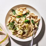 This Creamy Spinach Artichoke Protein Pasta Skillet showcases a satisfying bowl of pasta with visible artichokes.