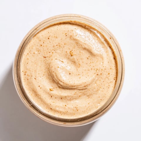 Creamy Quick Christmas Cookie Butter Spread, ready to spread on warm toast with a dusting of cinnamon.