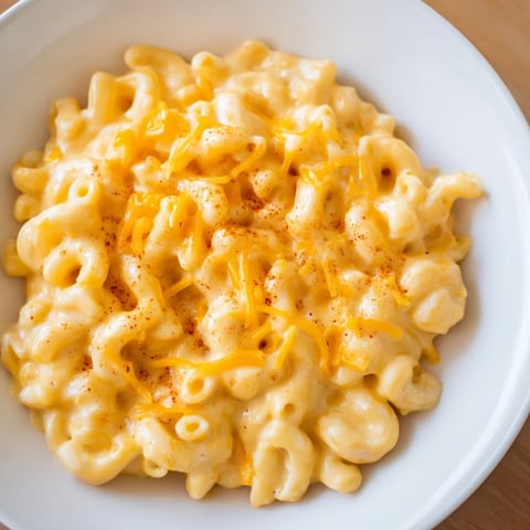 Tini's Recession Mac: A warm, bubbly casserole dish of creamy macaroni and cheese, ready to eat!