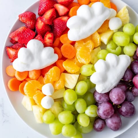 Rainbow Cloud Snack Board bursting with colorful fruits, perfect for a fun and healthy snack spread.