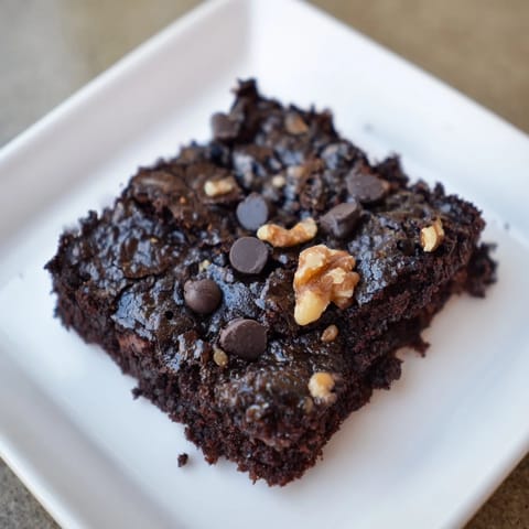 Delicious gluten-free black bean brownies, ready to slice, boasting a rich, chocolate aroma.