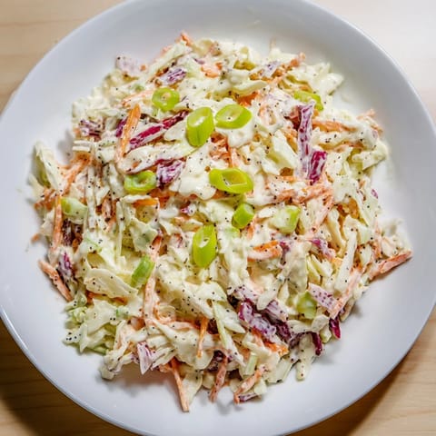 Freshly made Quick Coleslaw Salad with Creamy Dressing, showcasing a vibrant, colorful mix, a perfect side.