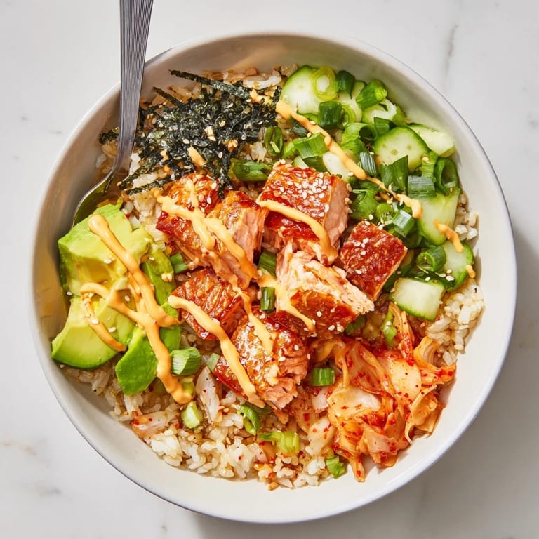Golden crunchy rice and succulent salmon slices create a tempting Crispy Salmon Rice Bowl.  