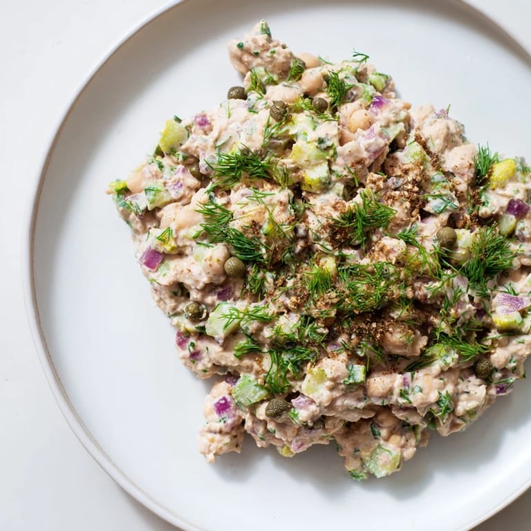 Close-up photo of chunky chickpea tuna salad, offering a savory ocean flavor and fresh ingredients.