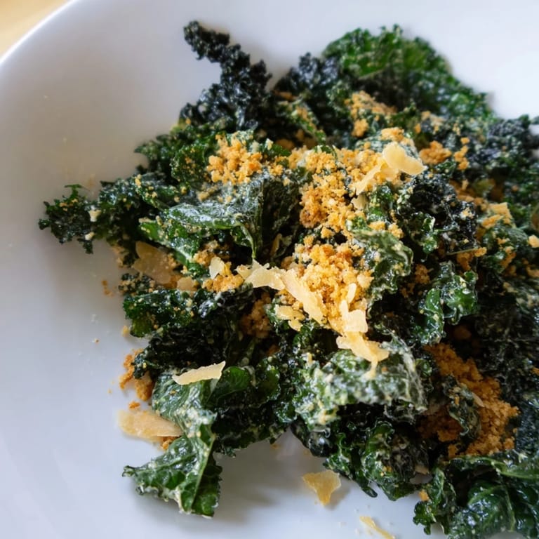 Tender massaged kale leaves topped with crunchy panko and shaved Parmesan in this Garlic Parmesan Kale Salad.