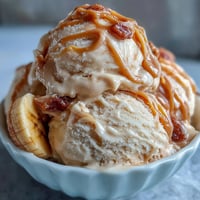 Creamy peanut butter banana ice cream made with just four simple ingredients for a healthy dessert.  
